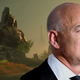 Jeff Bezos smiles with New World in the background.